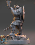 A detailed 3D model of a Viking warrior figure, holding a horn and sword, standing on a rocky outcrop.
