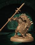 a statue of a demon holding a sword and shield