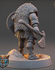 A detailed 3D model of a warrior figure, wearing a fur-trimmed helmet and carrying a large shield, standing on a platform and holding a sword.