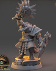 A detailed 3D model of a fantasy character, likely a dragon or mythical creature, standing on a pedestal and holding various weapons. The character appears to be a warrior or warrior-like figure, ready for battle or combat.