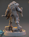 A detailed 3D model of a fantasy character, likely a warrior or warrior-like figure, standing on a rocky base and holding a weapon. The character has a large, furry coat and is wearing various armor pieces and accessories. The image does not contain any text or additional objects, and the character is the sole focus of the image.