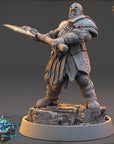 A detailed 3D model of a warrior figure, wearing a helmet and armor, holding a sword and shield, standing on a rocky platform.