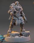 A detailed 3D model of a fantasy character, likely a dwarf or elf, standing on a rocky platform and holding various weapons and tools.