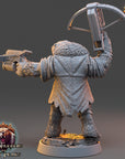 A 3D rendering of a fantasy character holding a crossbow and gun, with a bear-like appearance. The character is standing on a platform with the title "The Wardens of Fear" and "Daybreak Miniatures" displayed.