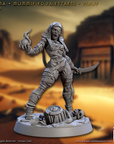 a statue of a man with a sword in a desert setting