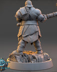 A 3D rendering of a muscular, armored figure holding a large weapon, standing on a rocky platform.