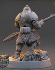 A detailed 3D model of a warrior figure, likely from a fantasy or adventure game, standing on a rocky base and holding a spear.