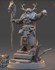 A detailed 3D model of a fantasy character, likely a deity or magical being, standing on a pedestal and holding a staff with a skull and crossbones symbol on it. The character is wearing a long robe and has antlers on their head.