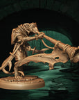 a statue of an elephant attacking a man in a tunnel