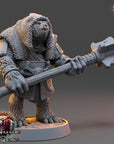 A 3D model of a bear-like creature holding a large weapon, likely a mace or club, in a fighting stance. The creature is wearing a fur-lined hood and has a fierce expression on its face. The image appears to be a 3D rendering of a fantasy character from a video game or other media.