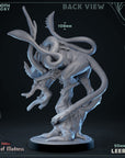 a statue of a creature with a large head