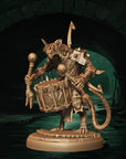 a statue of a demon holding a basket
