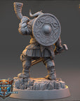 A detailed 3D model of a warrior figure, wearing a helmet and armor, standing on a rocky base.