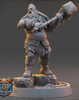 A 3D model of a dwarf warrior figure holding a large hammer, standing on a rocky base.