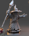 A 3D rendering of a wizard-like character holding a staff and standing on a rock, with the text "The Wardens of Fear" and "Daybreak Miniatures" visible in the image.