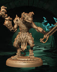 a statue of a demon holding a giant sword
