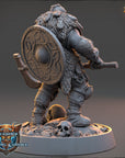 A detailed 3D model of a fantasy character, likely a dwarf or gnome, standing on a base with a skull and other objects. The character is wearing a helmet and armor, and is holding a shield. The image is described as a collage of multiple images, and it is not a single image but a collection of images.