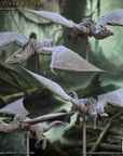 a group of white dragon figurines sitting on top of a metal pole