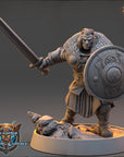 A detailed 3D model of a warrior figure, wearing a fur-trimmed helmet and armor, holding a sword and shield. The figure is standing on a rocky base and appears to be in a fighting stance.