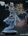 a statue of two women sitting on top of a cake