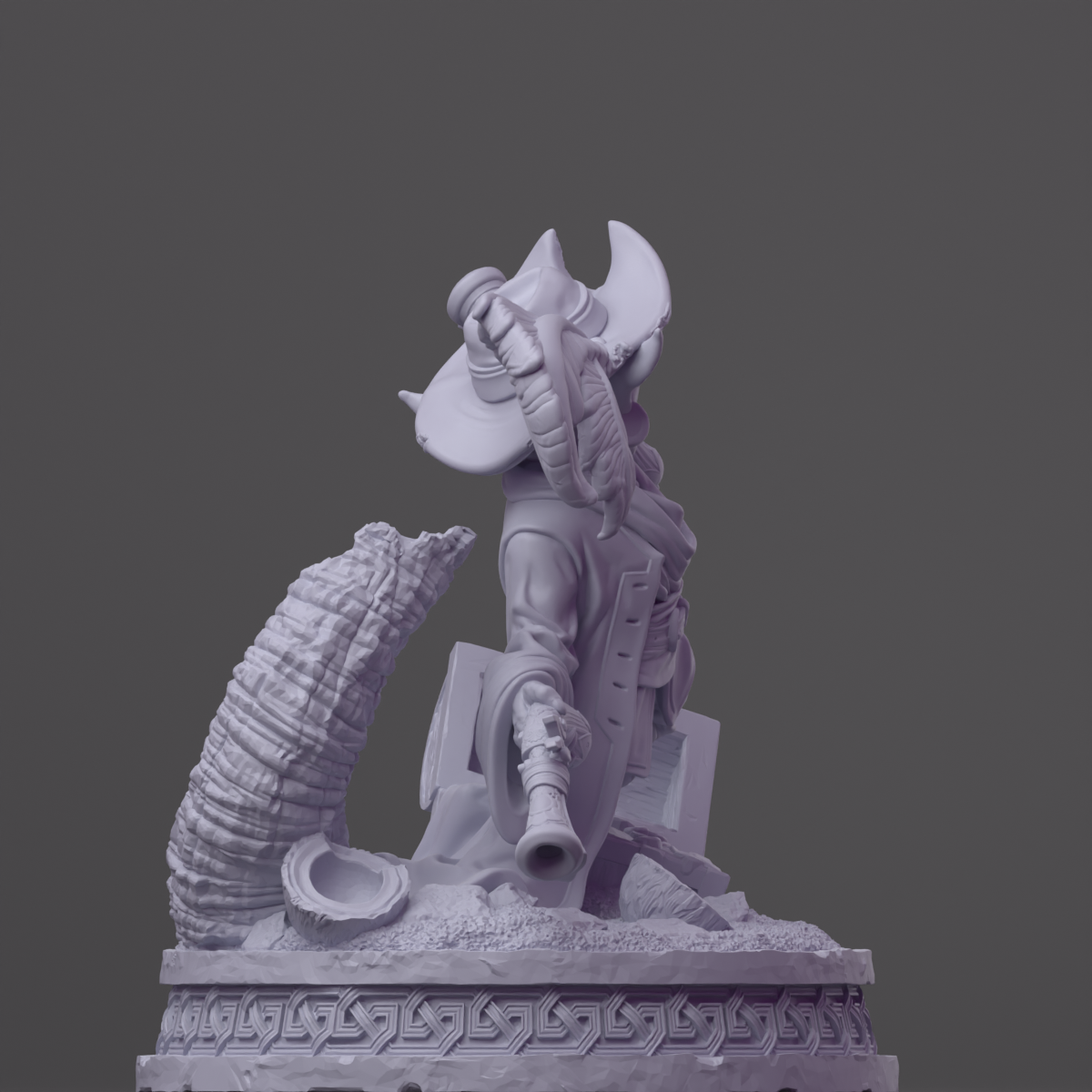 a statue of a man with a hat and a gun