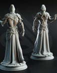 two detailed statues of a person with a hooded cloak, standing on pedestals against a dark background.