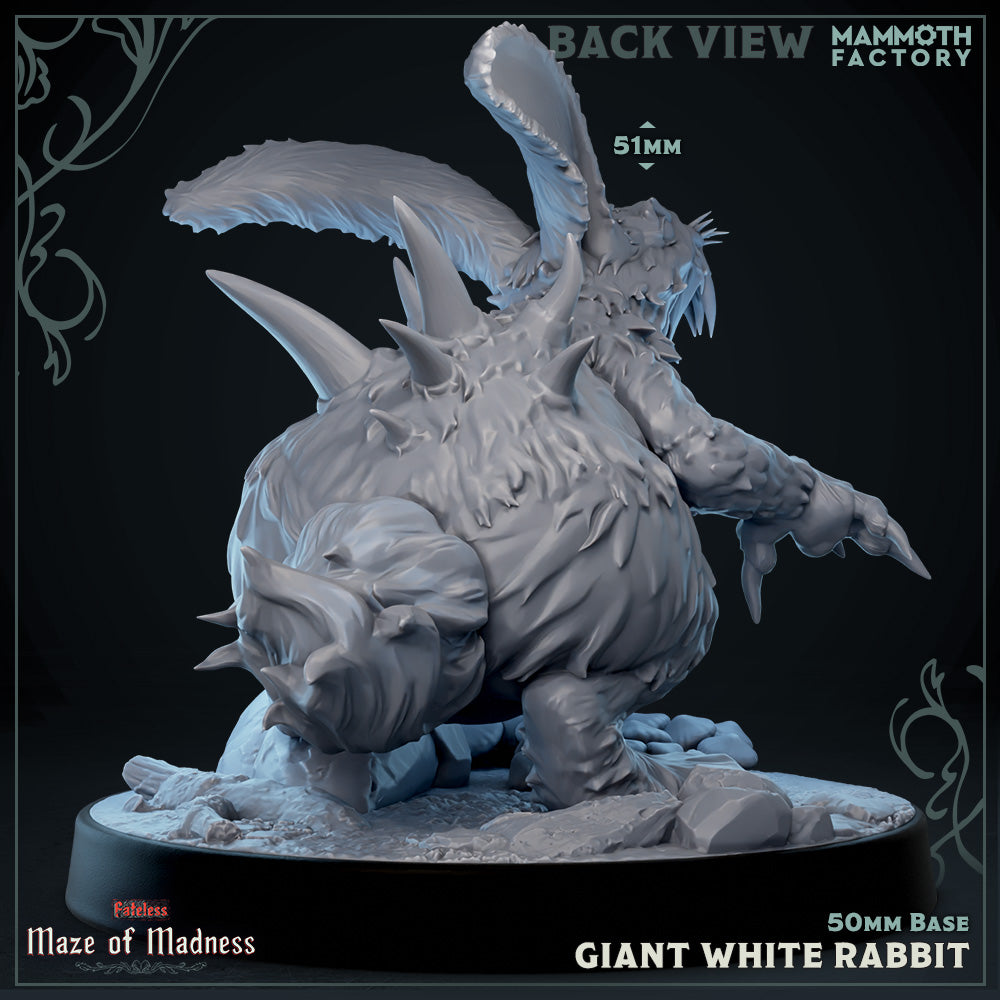 a statue of a giant white rabbit on a black background