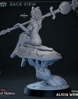 a statue of a woman holding a sword on top of a rock