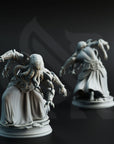 two figurines of a fantastical creature with tentacles, standing on pedestals against a dark background.