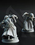 two detailed sculptures of fantastical creatures, likely mythical or magical, set against a dark background.