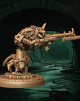 a statue of a creature with a gun in its hand