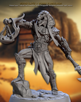 a statue of a man in a desert setting
